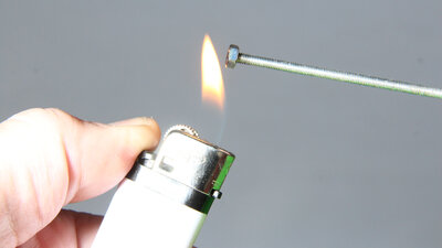 Heating the nuts with a lighter